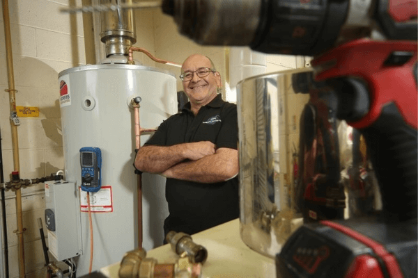 Sean Jackson, one of the directors of ASH Integrated Services stood beside a boiler