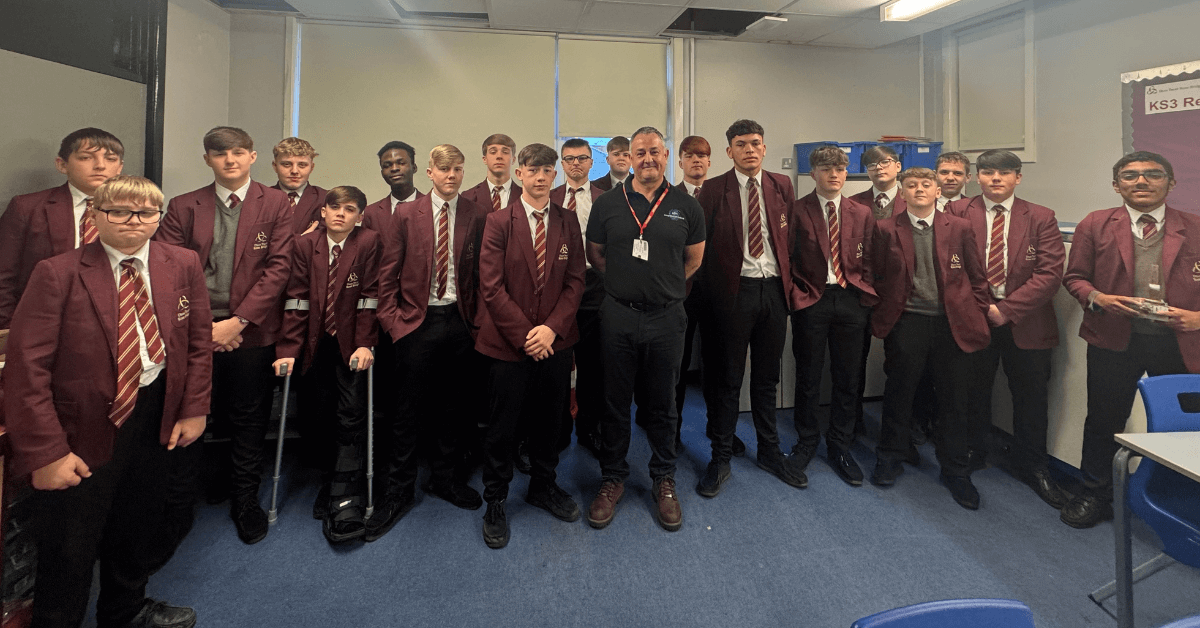 a group of people in school uniforms posing for a photo