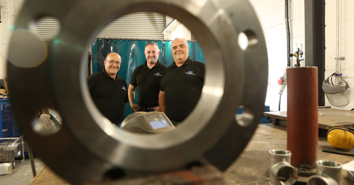 The three directors of ASH Integrated Services stood side by side