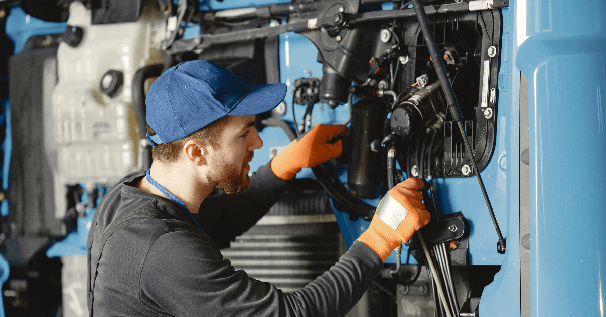 Image shows mechanical engineer carrying out maintenance on a mechanical system