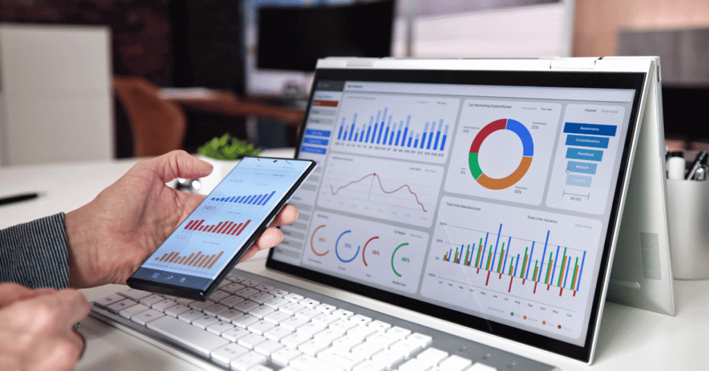 Image shows laptop with energy charts and graphs