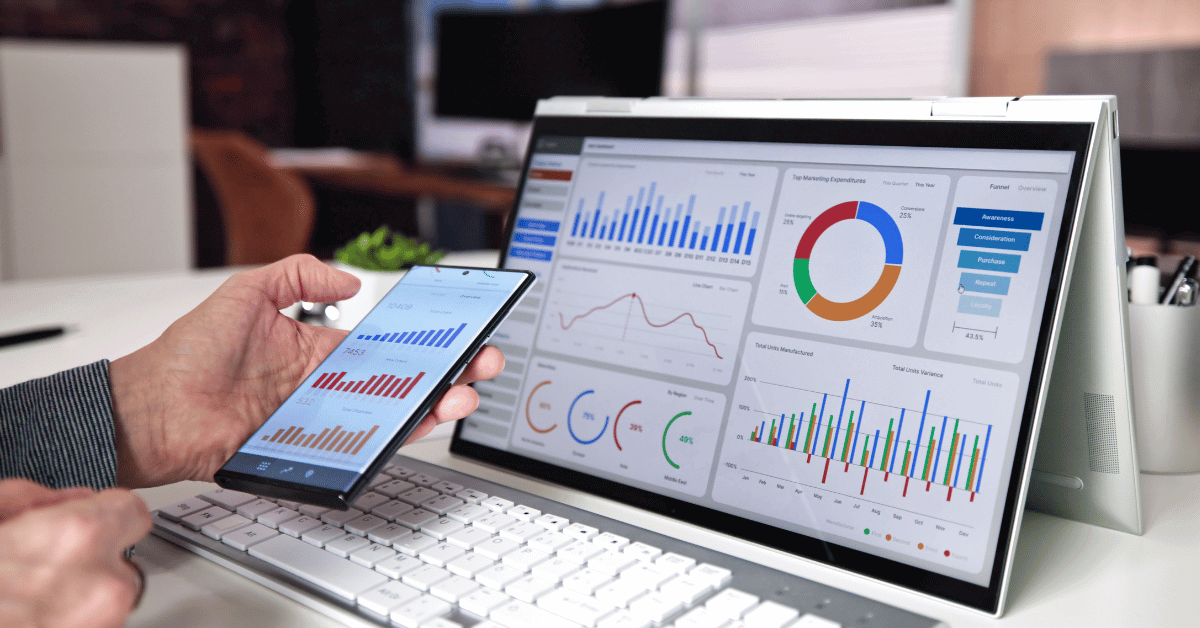 Image shows laptop with energy charts and graphs