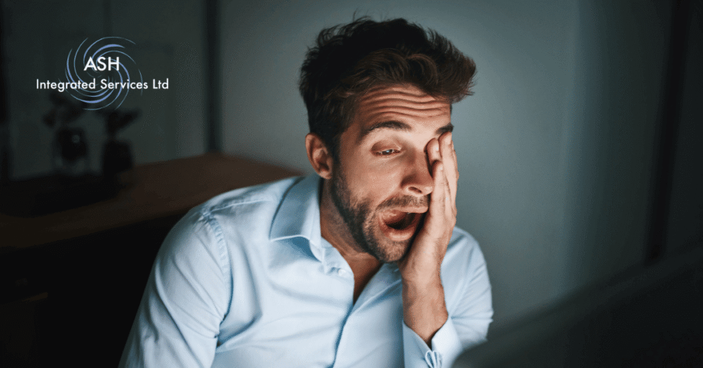 ASH Integrated Services image shows black man dressed in a blue shirt yawning