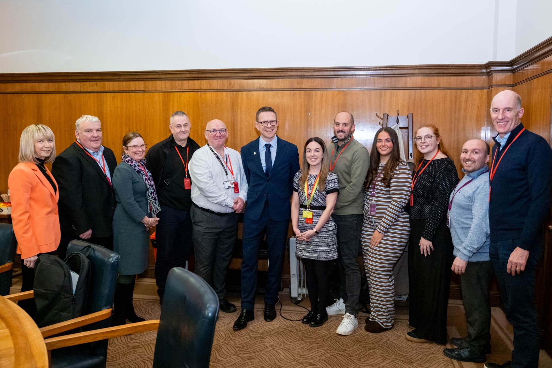 Image shows ten business people smiling after joining the Apprenticeship Ambassador Network