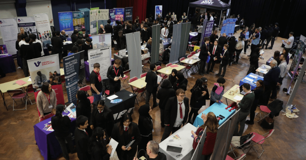 Image shows a busy school hall for a careers fair