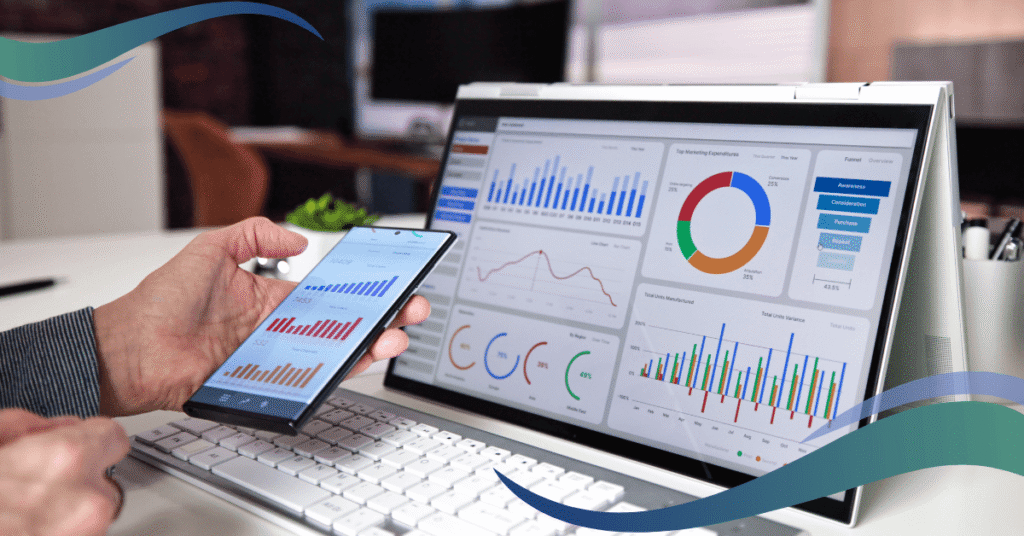 Image shows laptop with energy charts and graphs