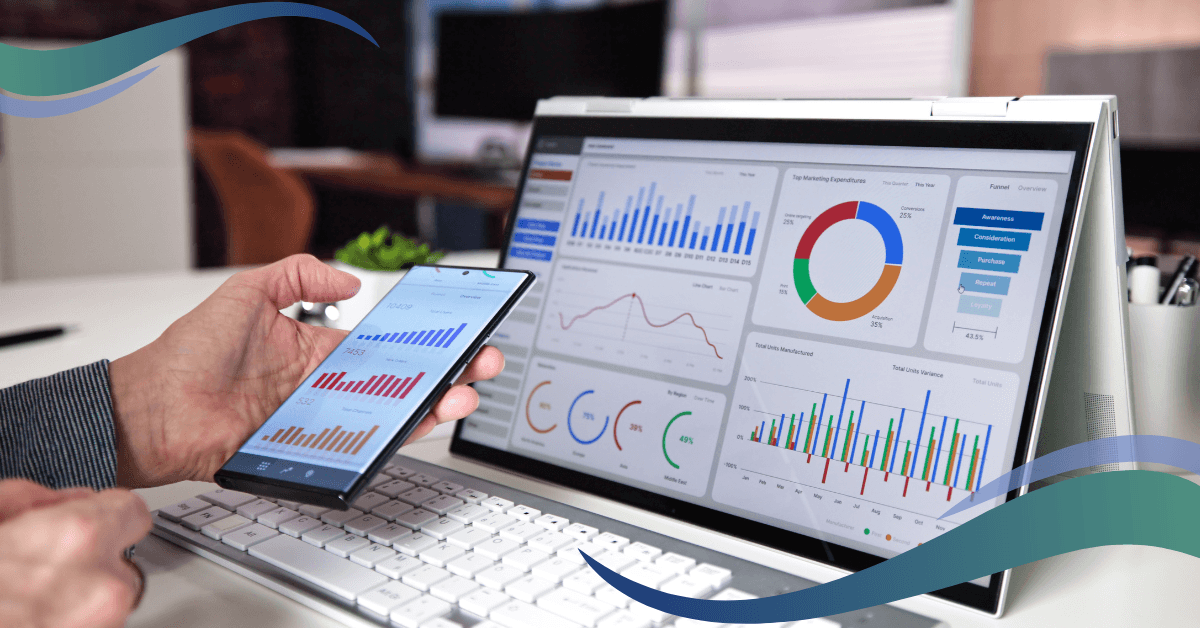 Image shows laptop with energy charts and graphs