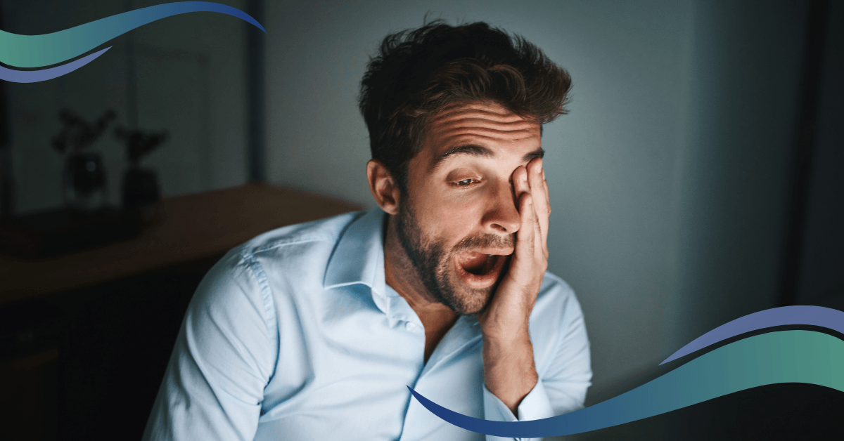 ASH Integrated Services image shows black man dressed in a blue shirt yawning