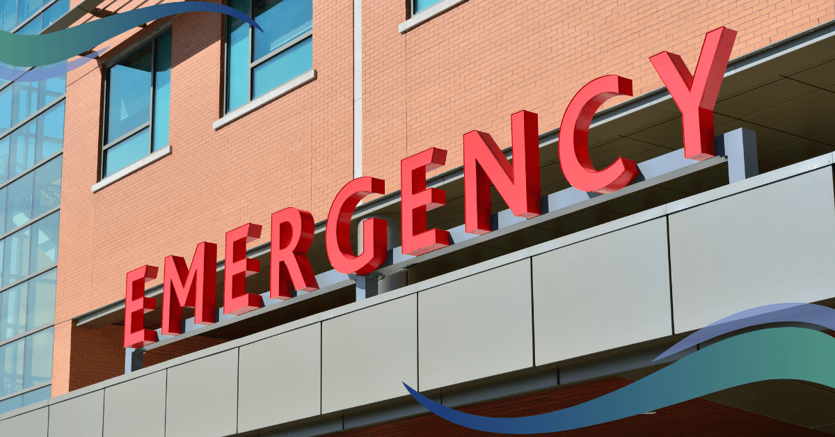 The word "EMERGENCY" in large red letters is displayed on the exterior of a building.