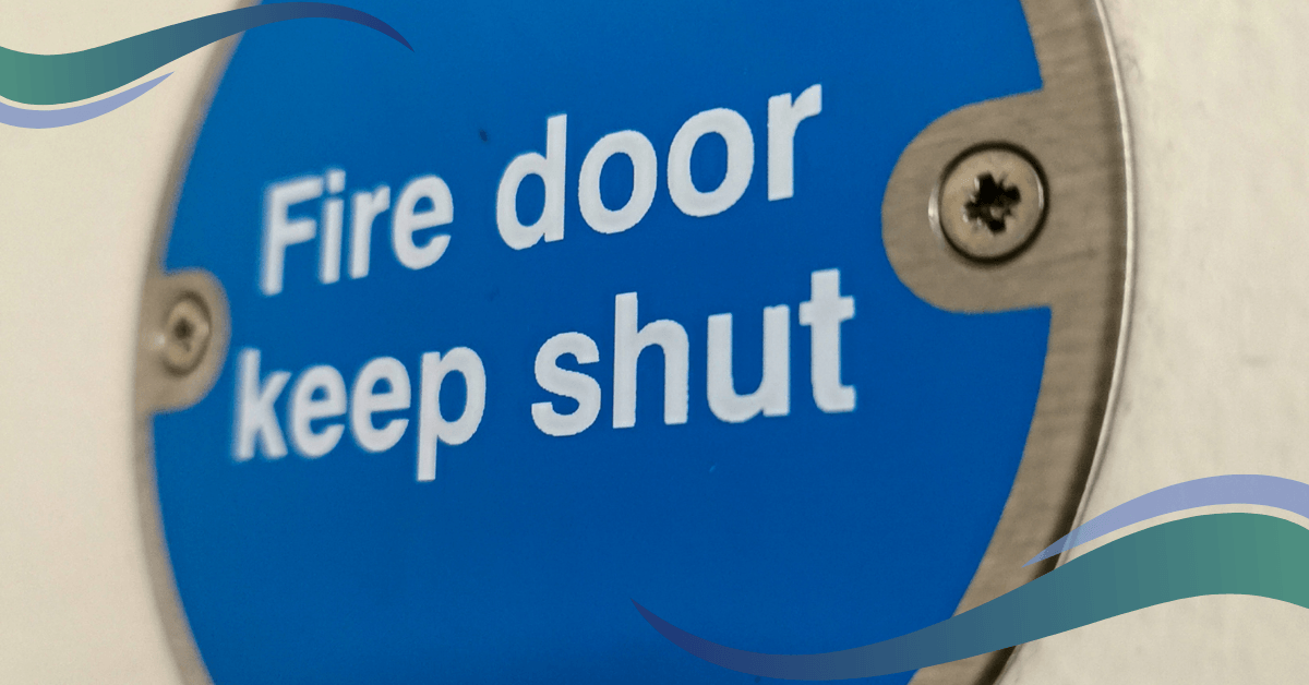 a blue and white sign that says fire door keep shut