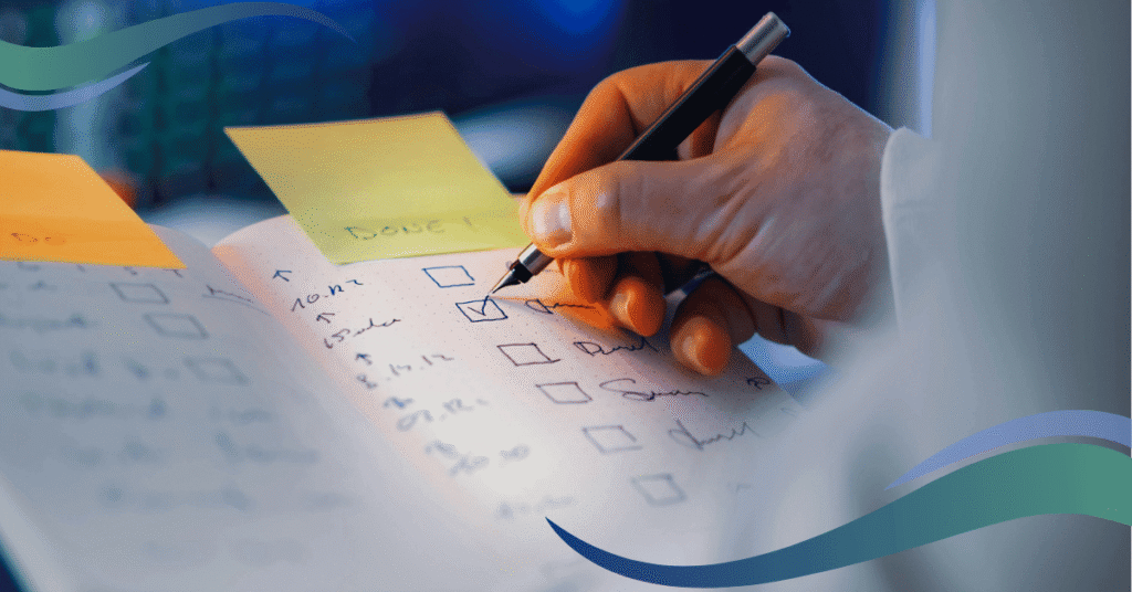 Hand holding a pen marking of a check list
